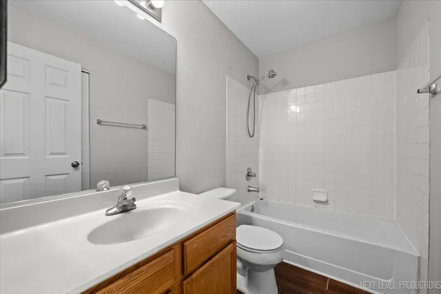 a bathroom with a sink toilet tub and shower