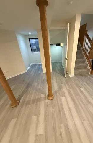 a view of entryway with wooden floor