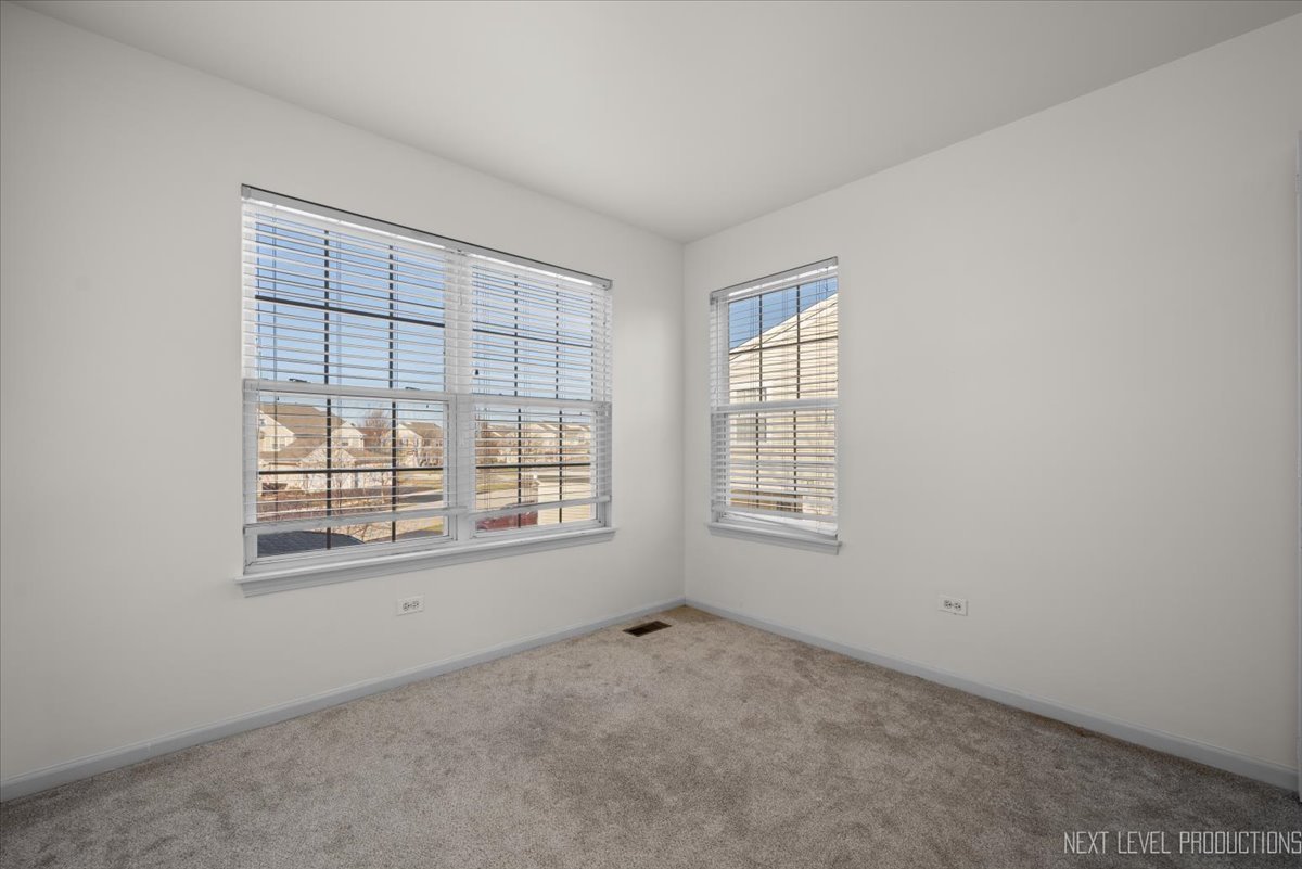 2819 White Thorn Circle Naperville, IL 60564 - Photo 9 of 23 an empty room with a window