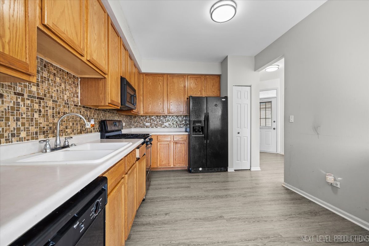 2819 White Thorn Circle Naperville, IL 60564 - Photo 10 of 23 a kitchen with stainless steel appliances a refrigerator sink and cabinets