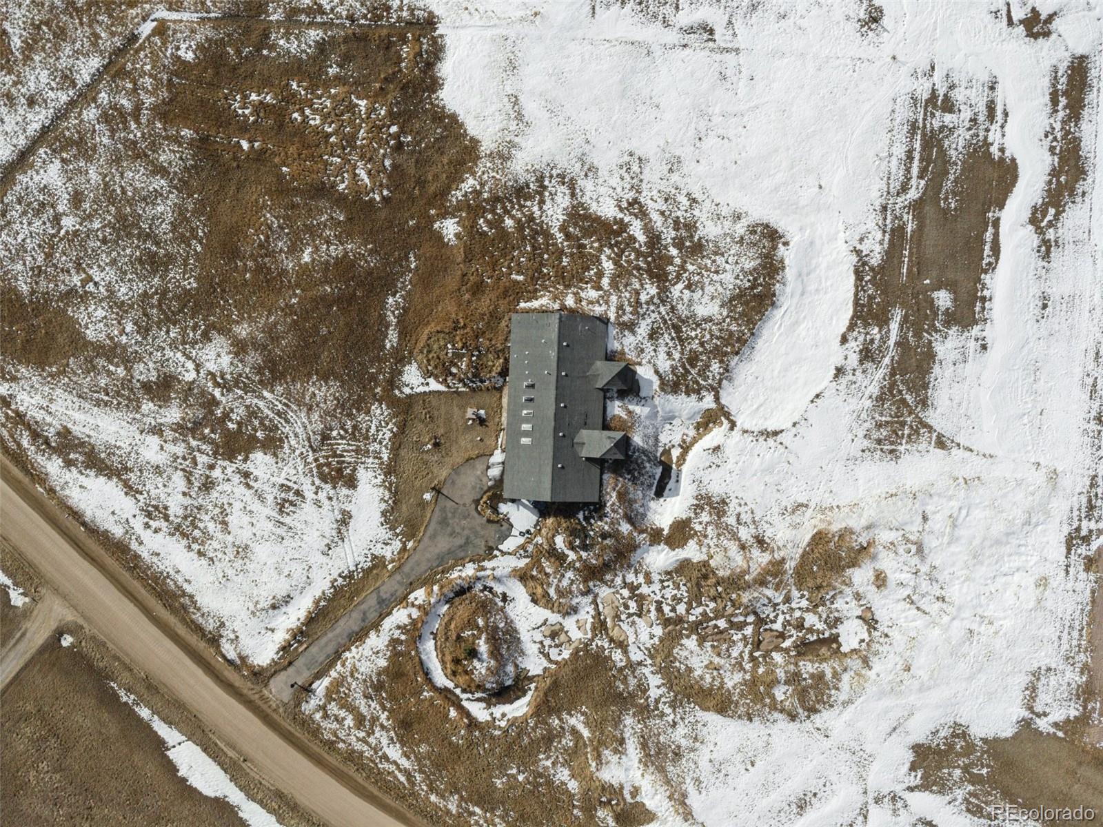 24521 Ben Kelly Road Elbert, CO 80106 - Photo 3 of 25 a view of roof with a yard