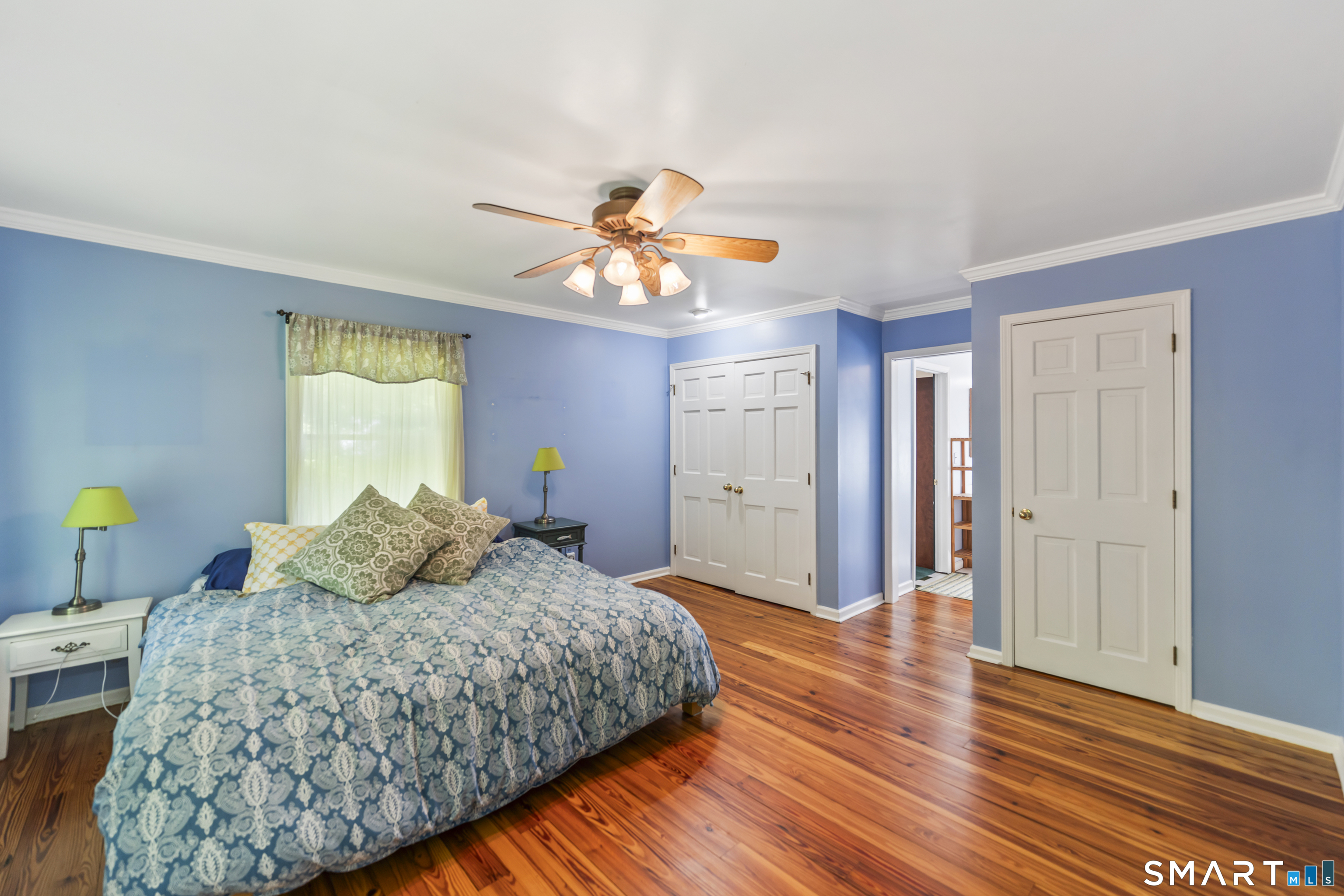18 Gelding Hill Road Newtown, CT 06482 - Photo 24 of 40 a bedroom with a bed and a chandelier