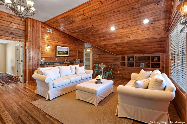 a outdoor space with pool table and wooden floor