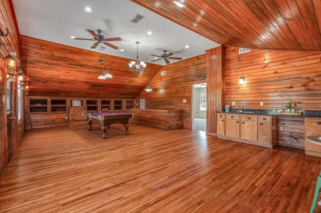 a bed room with a bed mirror and a window