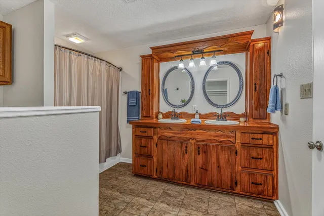 a view of a balcony with wooden floor and iron stairs