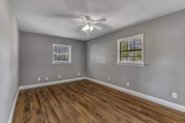 a view of a city with flower and trees