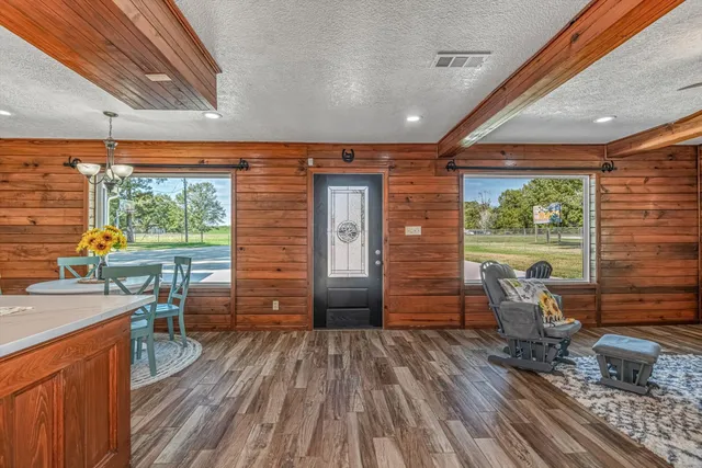 a backyard of a house with outdoor seating