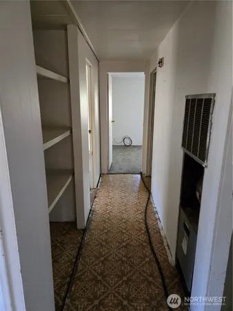 a view of an empty room with a window