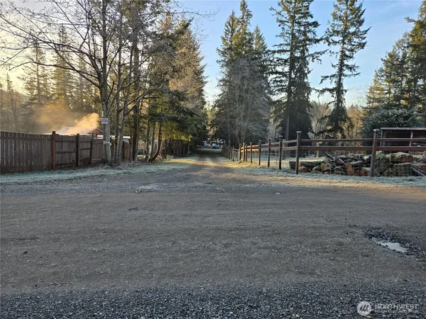 a view of a yard with basketball court