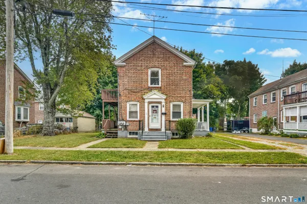 a front view of a house with a yard