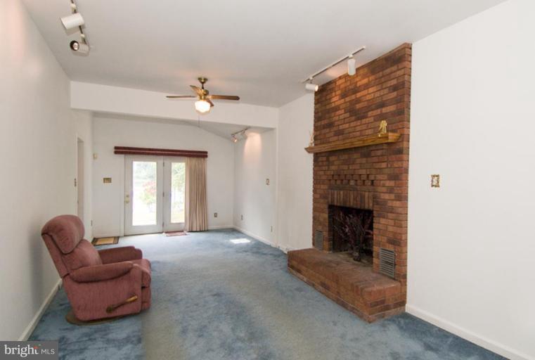 508 Grovethorn Road Middle River, MD 21220 - Photo 9 of 19 a living room with furniture and a fireplace