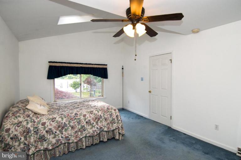 508 Grovethorn Road Middle River, MD 21220 - Photo 10 of 19 a bedroom with a bed and a chandelier