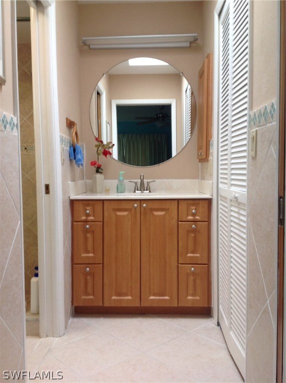 25 Michigan Road Lehigh Acres, FL 33936 - Photo 10 of 16 a bathroom with a sink and a mirror