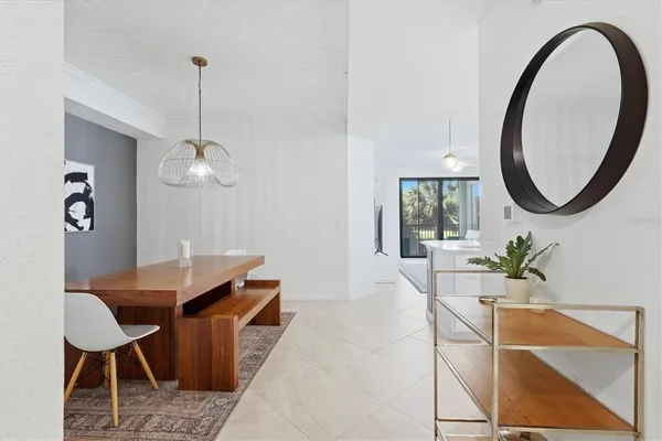a dining room with furniture and window