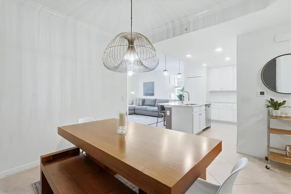 a view of kitchen and dining area with wooden floor