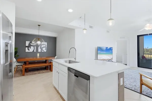 a view of a kitchen area with furniture and chandelier