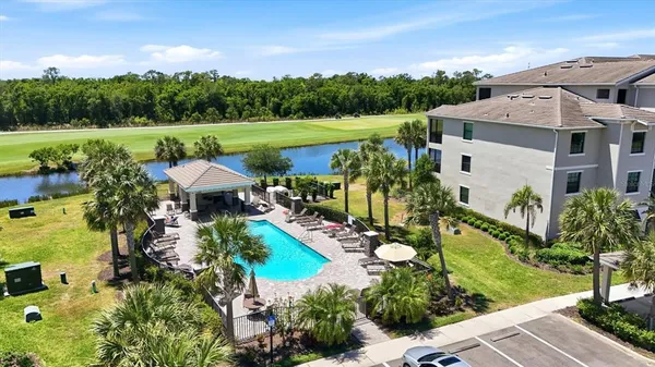 an aerial view of a house with garden space and outdoor seating