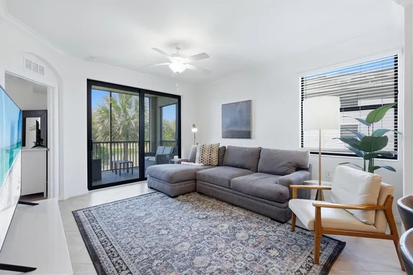 a living room with furniture and a rug