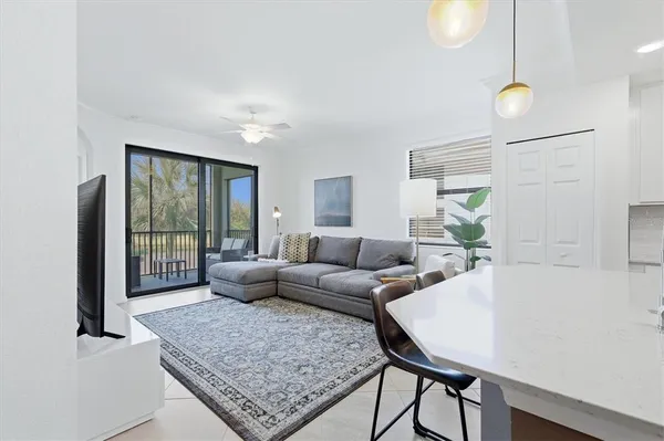 a living room with furniture and a large window