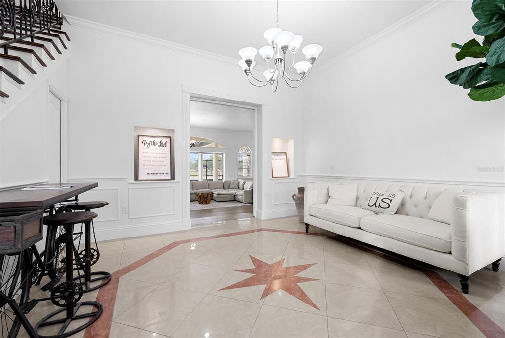 1450 Bern Creek Loop Sarasota, FL 34240 - Photo 12 of 95 a living room with furniture and wooden floor