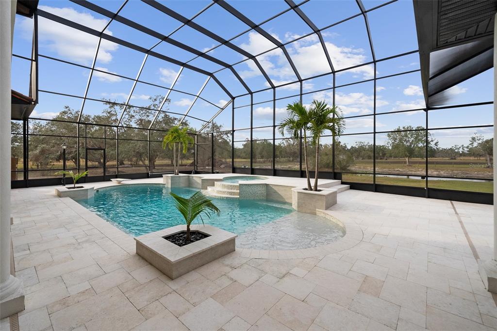1450 Bern Creek Loop Sarasota, FL 34240 - Photo 34 of 95 a view of a swimming pool with a patio