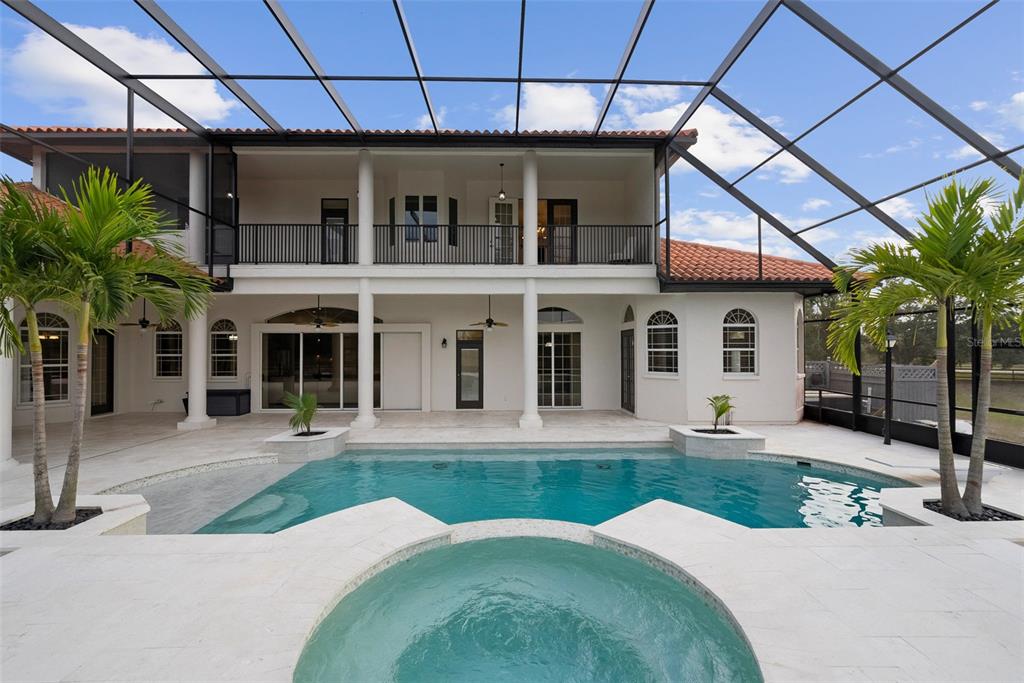 1450 Bern Creek Loop Sarasota, FL 34240 - Photo 49 of 95 a view of a house with a backyard