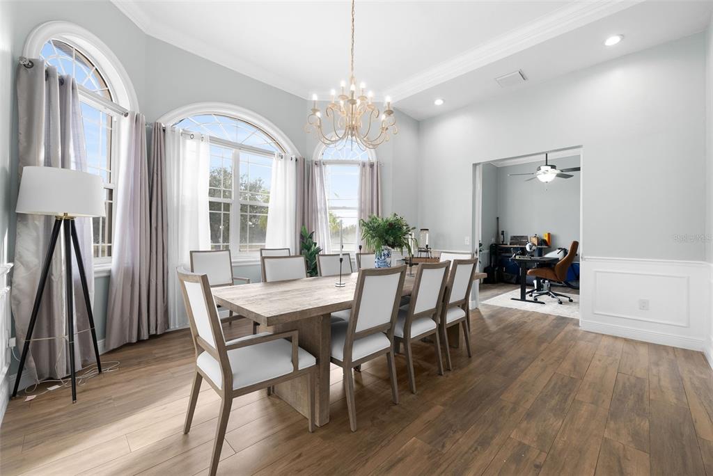 1450 Bern Creek Loop Sarasota, FL 34240 - Photo 50 of 95 a view of a dining room with furniture and wooden floor