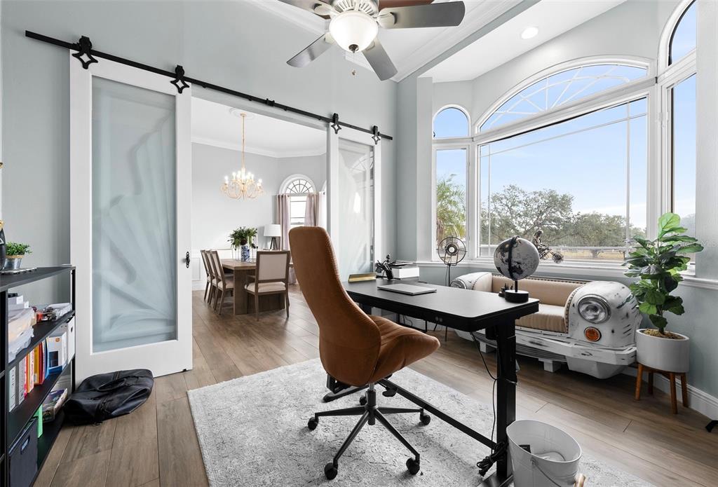 1450 Bern Creek Loop Sarasota, FL 34240 - Photo 52 of 95 a workspace with furniture and a large window
