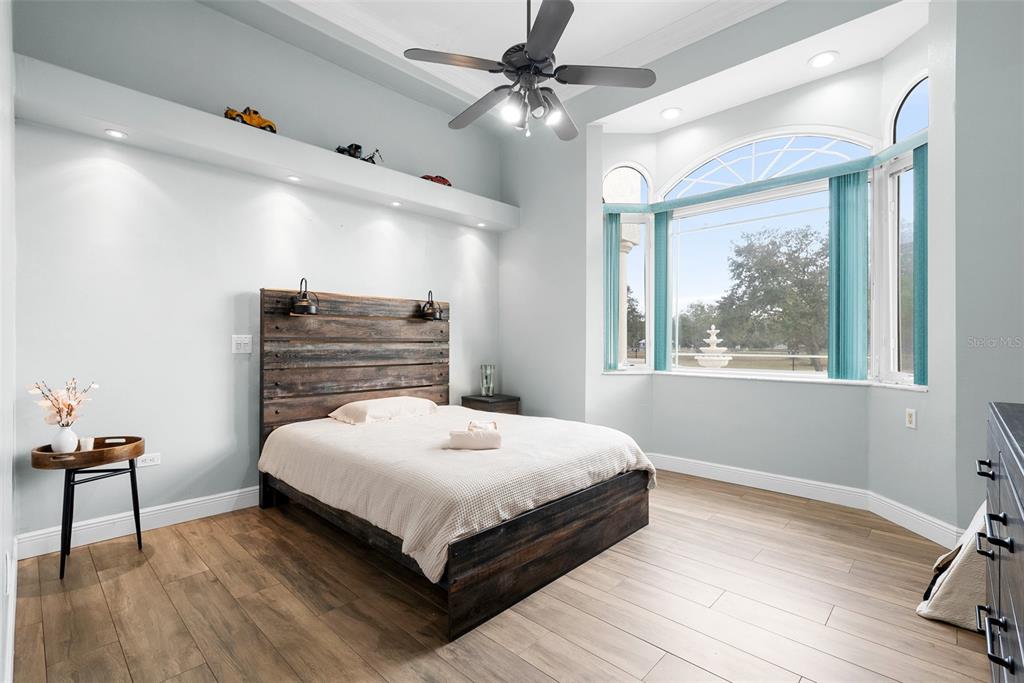 1450 Bern Creek Loop Sarasota, FL 34240 - Photo 55 of 95 a bedroom with a bed and a table