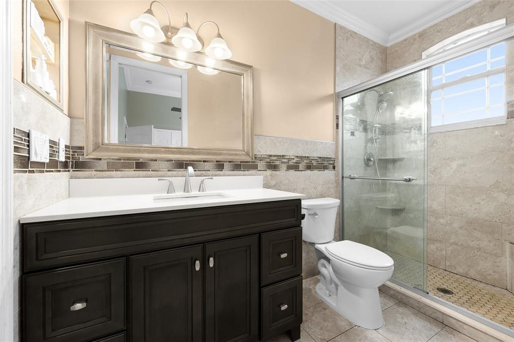 1450 Bern Creek Loop Sarasota, FL 34240 - Photo 63 of 95 a bathroom with a sink vanity mirror and toilet