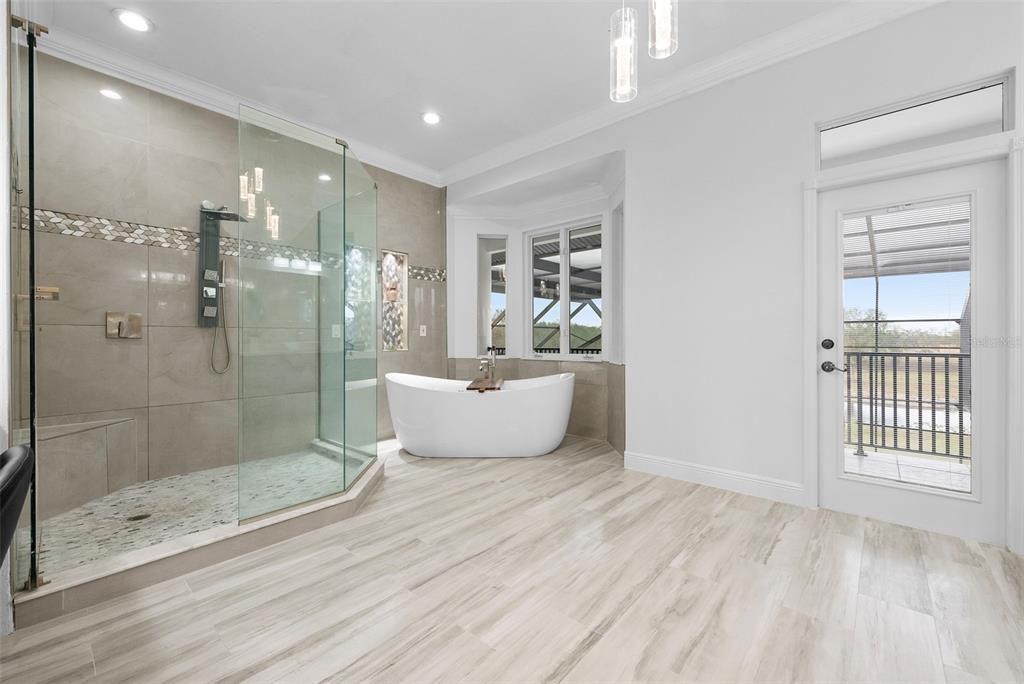 1450 Bern Creek Loop Sarasota, FL 34240 - Photo 80 of 95 a bathroom with a bathtub and a shower