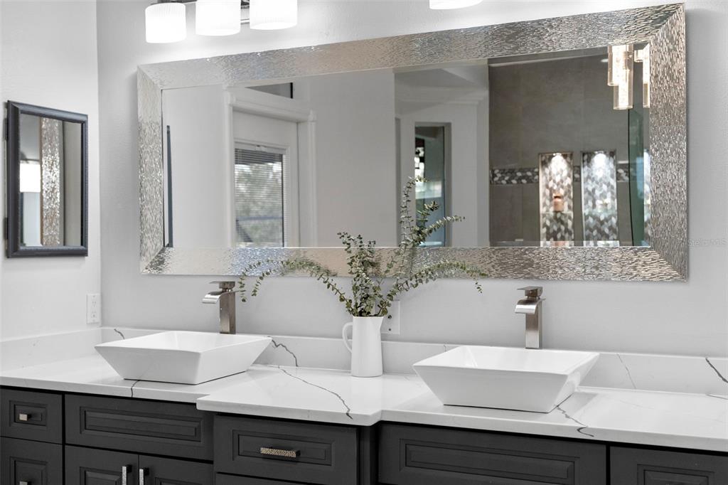 1450 Bern Creek Loop Sarasota, FL 34240 - Photo 85 of 95 a bathroom with double vanity sinks and a mirror