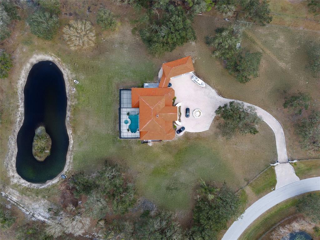 1450 Bern Creek Loop Sarasota, FL 34240 - Photo 94 of 95 an aerial view of a house with backyard