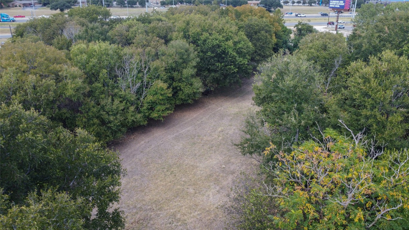 1322 North Interstate 35 San Marcos, TX 78666 - Photo 9 of 22 an aerial view of a house with a yard and greenery space