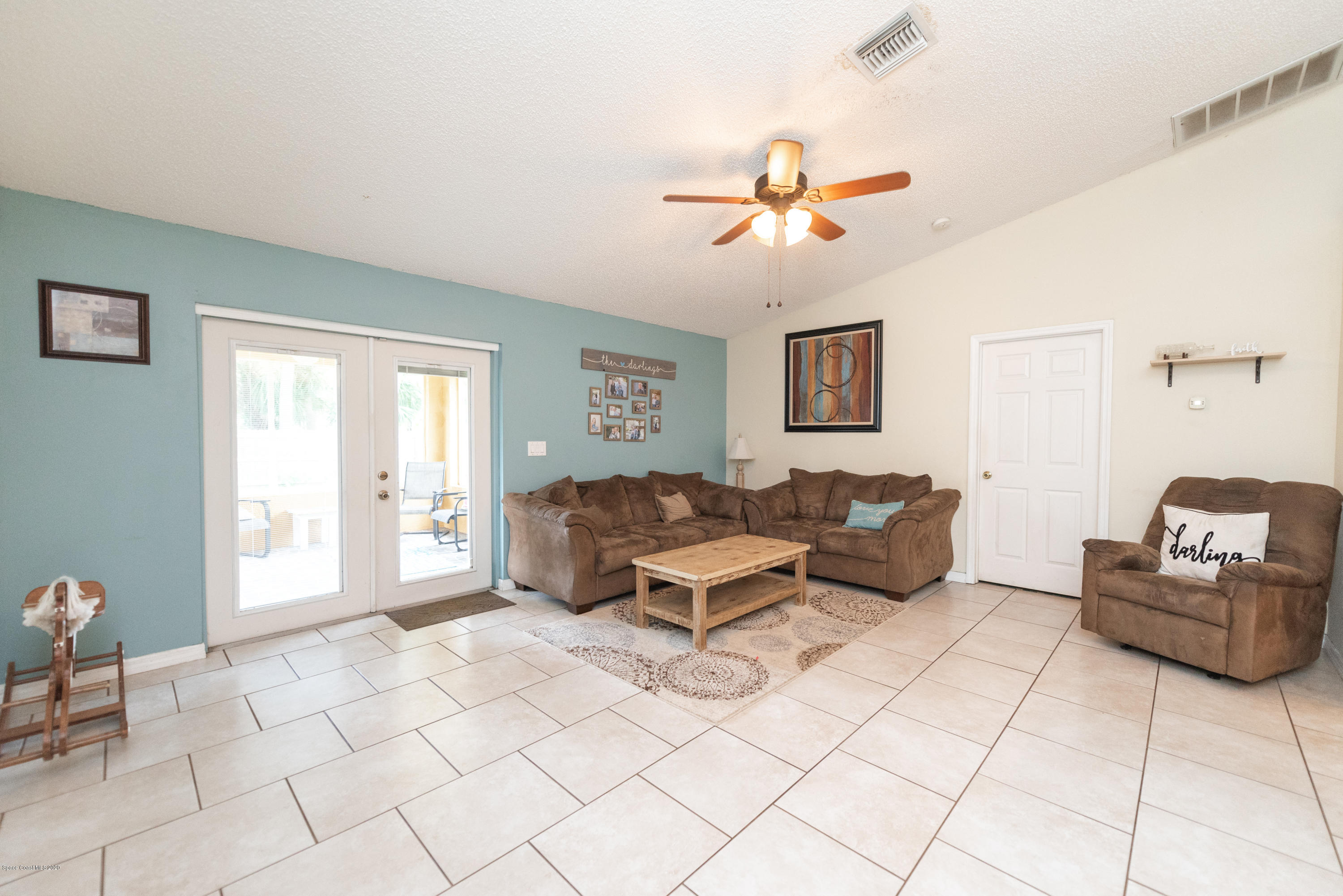 6040 Adina Road Cocoa, FL 32927 - Photo 8 of 23 a living room with furniture and a window
