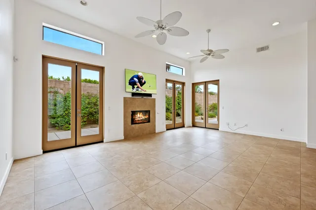 a large kitchen with stainless steel appliances granite countertop a large counter top and a sink