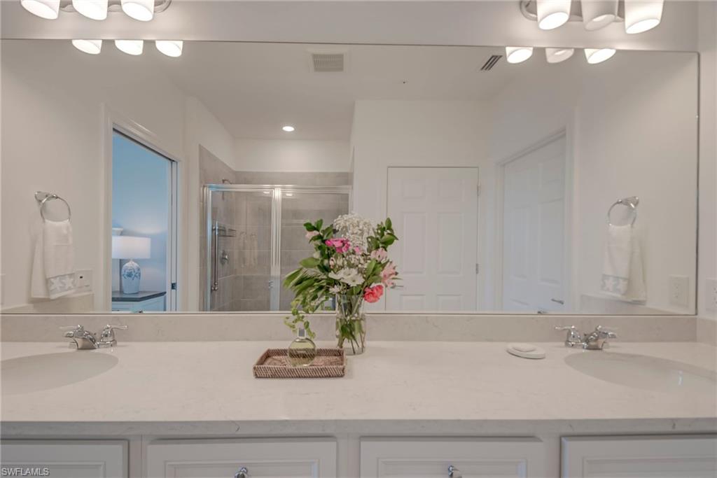 5686 Mayflower Way, Unit 702 Ave Maria, FL 34142 - Photo 20 of 50 Master Bathroom featuring double vanity and a walk-in shower