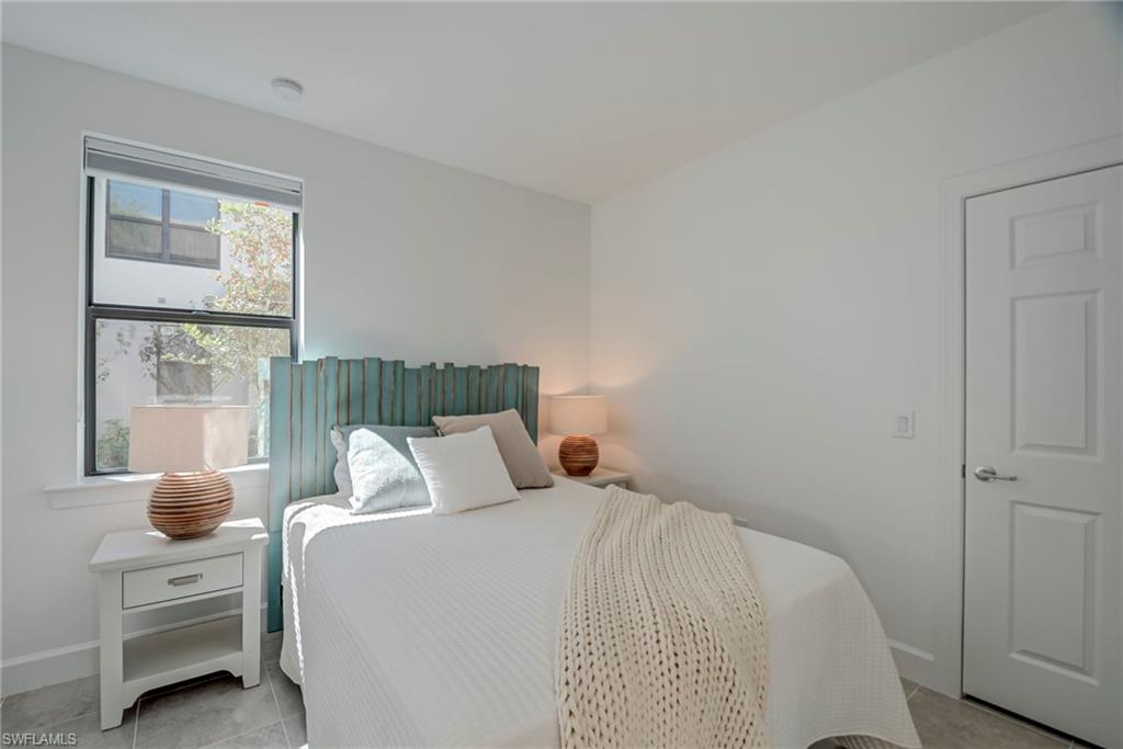 5686 Mayflower Way, Unit 702 Ave Maria, FL 34142 - Photo 22 of 50 Cozy Guest Bedroom with walk-in closet
