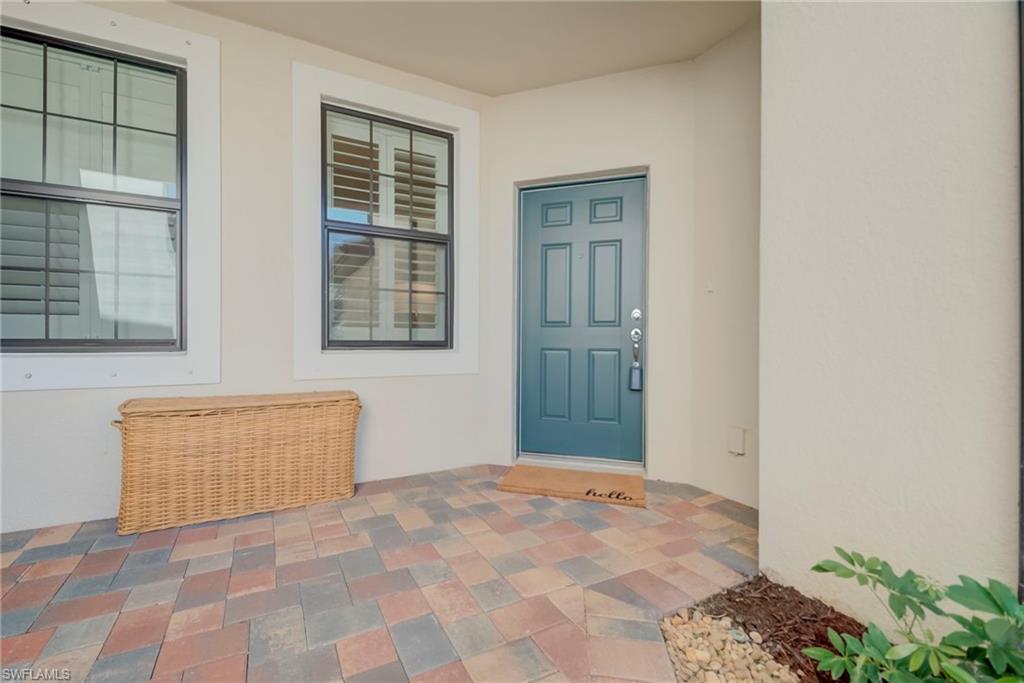 5686 Mayflower Way, Unit 702 Ave Maria, FL 34142 - Photo 7 of 50 Entrance to property with stucco siding