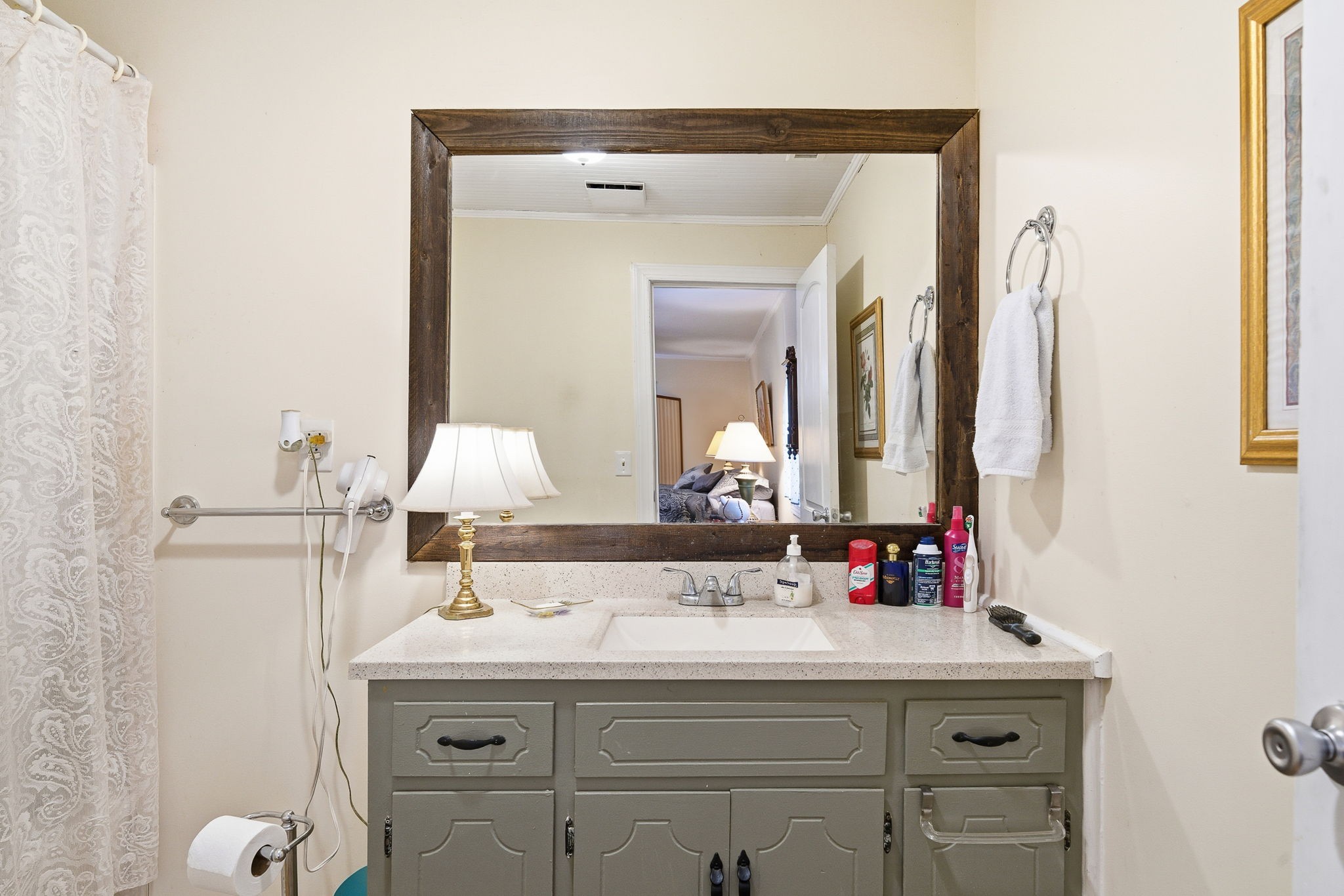 143 Double Springs Road Cookeville, TN 38501 - Photo 17 of 38 a bathroom with a sink vanity and mirror