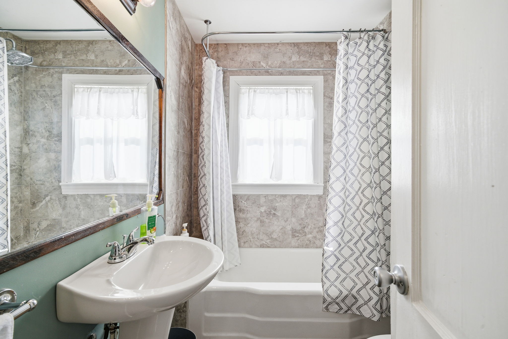 143 Double Springs Road Cookeville, TN 38501 - Photo 23 of 38 a bathroom with a sink and a mirror