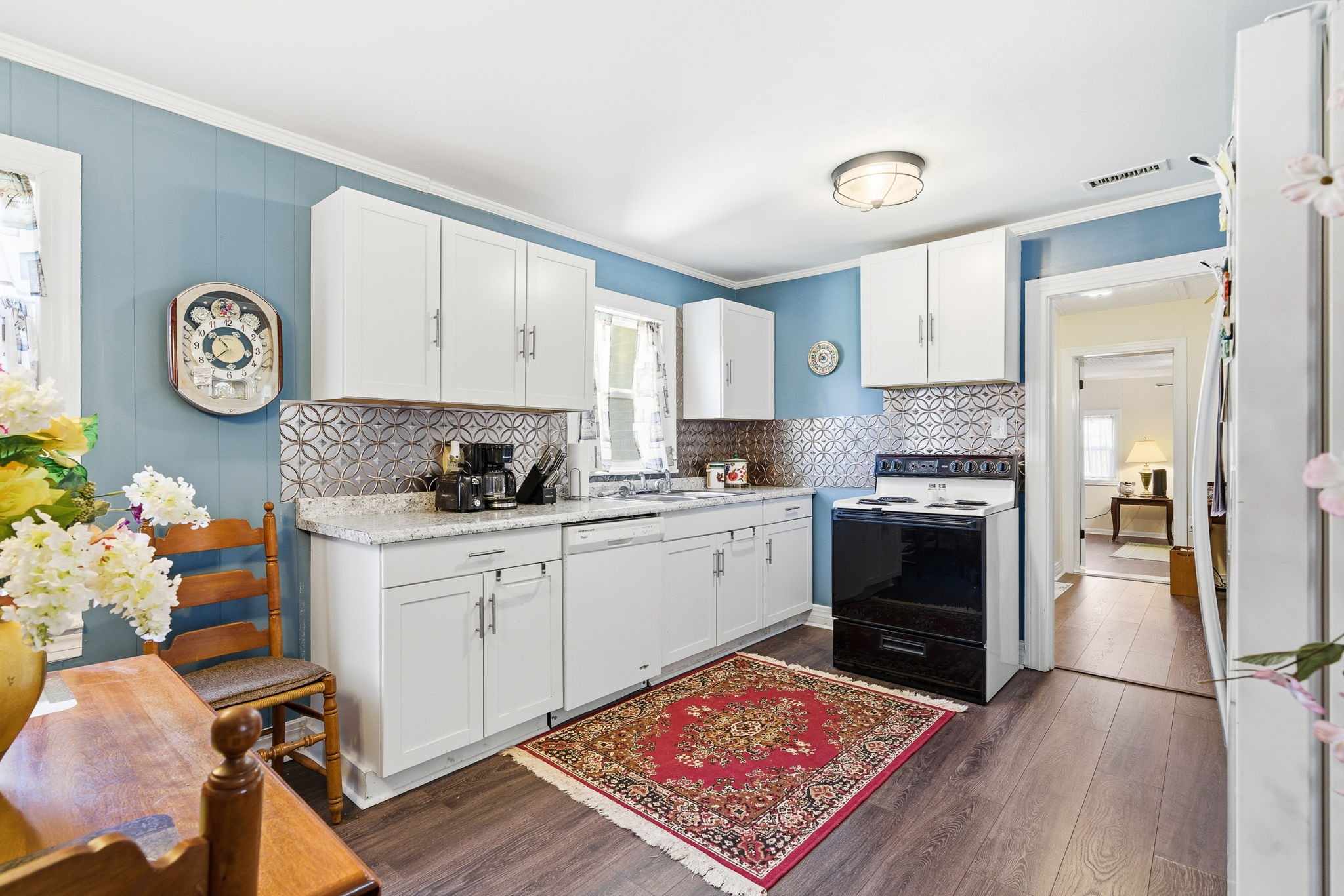 143 Double Springs Road Cookeville, TN 38501 - Photo 7 of 38 a kitchen with a stove a refrigerator and a stove with wooden floor