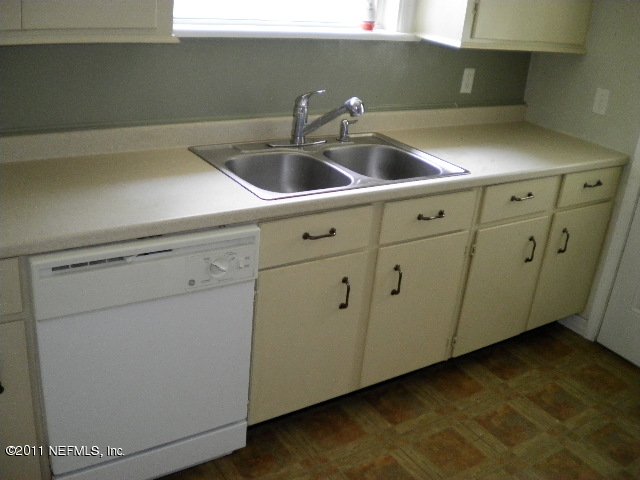 1785 Planters Road Jacksonville, FL 32207 - Photo 5 of 8 a close view of sink and cabinets