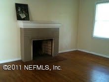 1785 Planters Road Jacksonville, FL 32207 - Photo 7 of 8 a view of an empty room with wooden floor