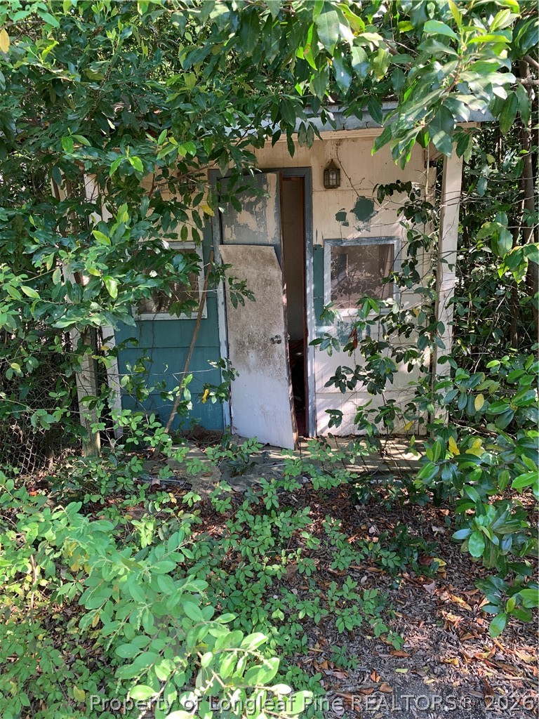 2661 Wingate Road Fayetteville, NC 28306 - Photo 13 of 13 a view of a house with a tree