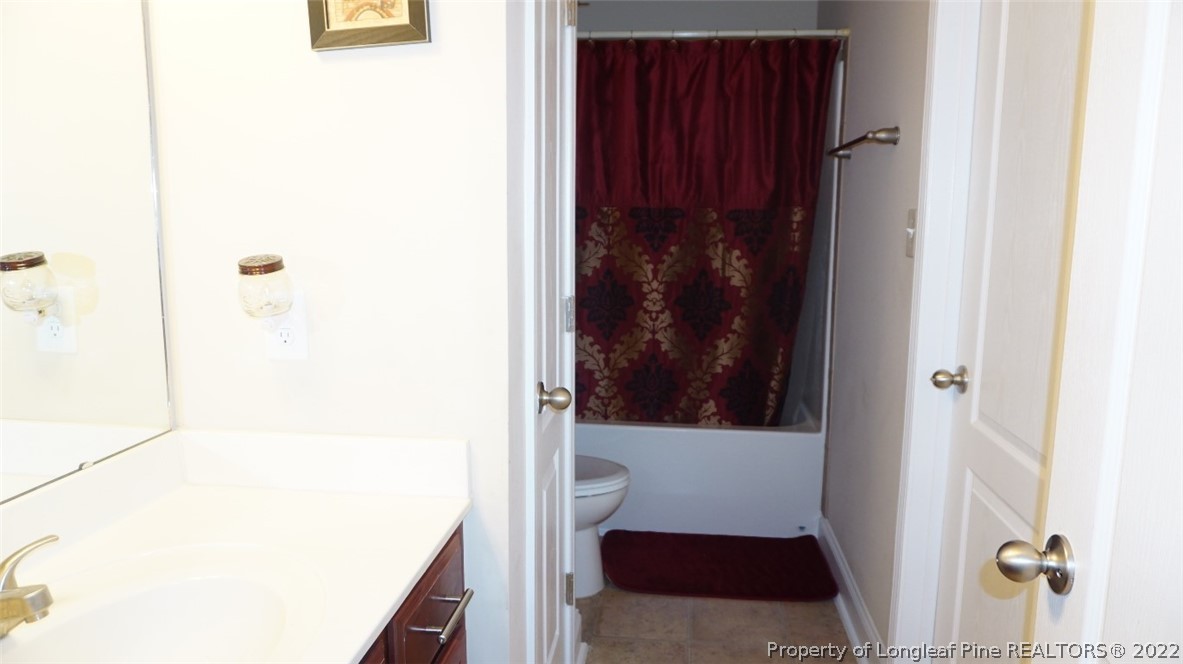115 Shellbark Drive Spring Lake, NC 28390 - Photo 13 of 30 a bathroom with a shower and a sink