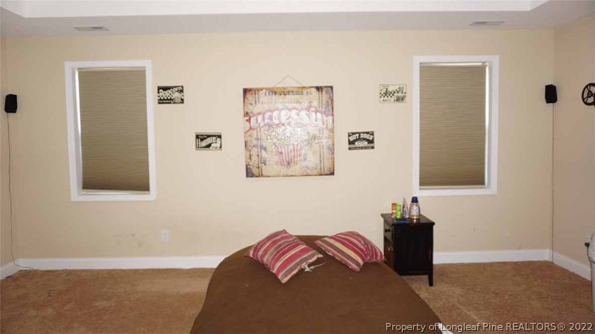 115 Shellbark Drive Spring Lake, NC 28390 - Photo 19 of 30 a bedroom with a bed and a window