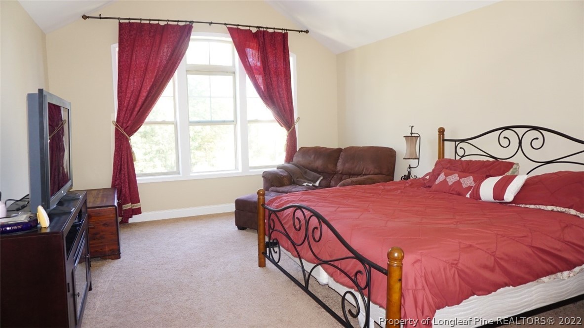 115 Shellbark Drive Spring Lake, NC 28390 - Photo 22 of 30 a bedroom with a bed and a window