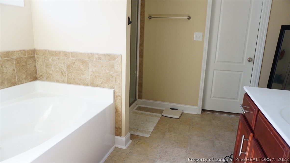 115 Shellbark Drive Spring Lake, NC 28390 - Photo 26 of 30 a en suite bathroom with a granite countertop sink