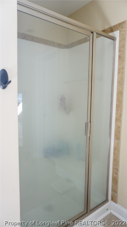 115 Shellbark Drive Spring Lake, NC 28390 - Photo 27 of 30 a bathroom with a glass shower door